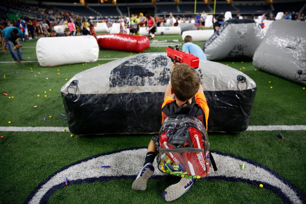Kyson Henderson, 9, fires a Nerf gun during Jared's Epic Nerf Battle 2 at AT&T Stadium in...