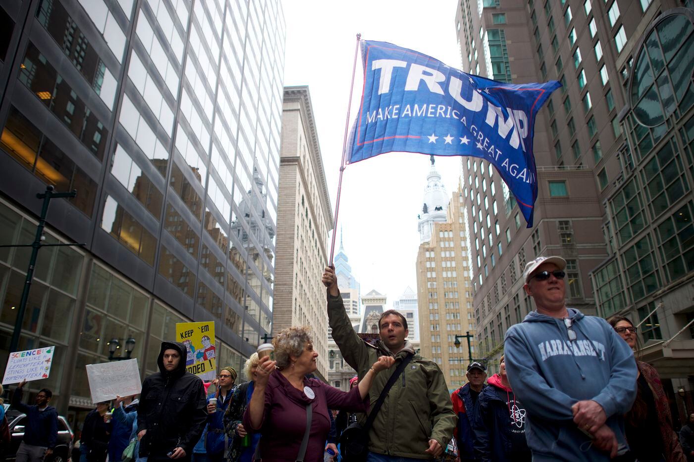 A man waves a Donald Trump flag during the March for Science in Philadelphia, April 22,...