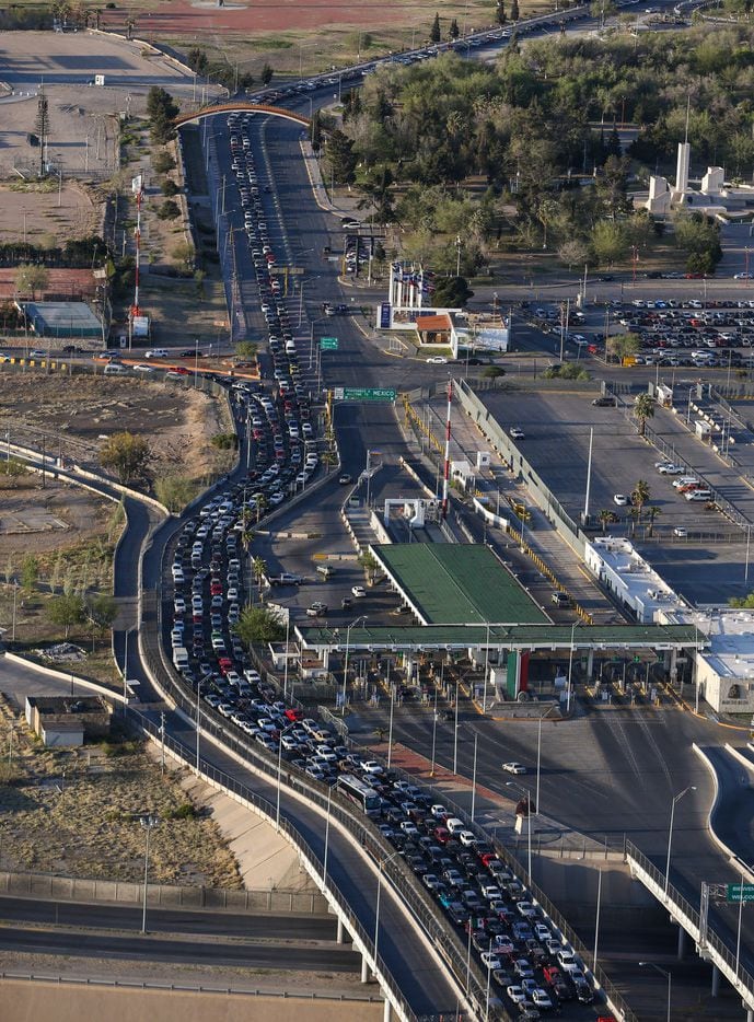Cars line up to enter the United States through the Bridge of the Americas Port of Entry in...