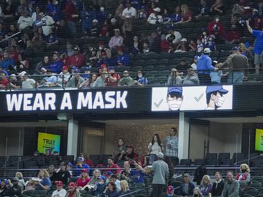 Signs encouraged fans to wear face masks as the Texas Rangers faced the Baltimore Orioles at Globe Life Field on April 17, 2021.