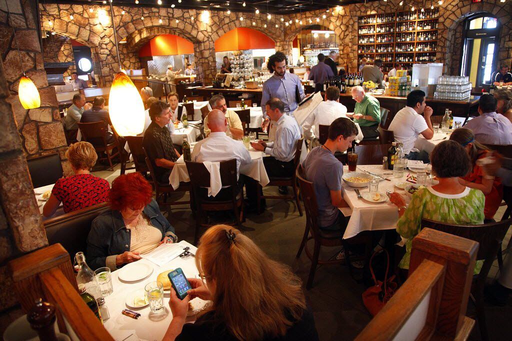 The noon-hour crowd used to fill in for lunch at Romano's Macaroni Grill on Northwest Hwy...