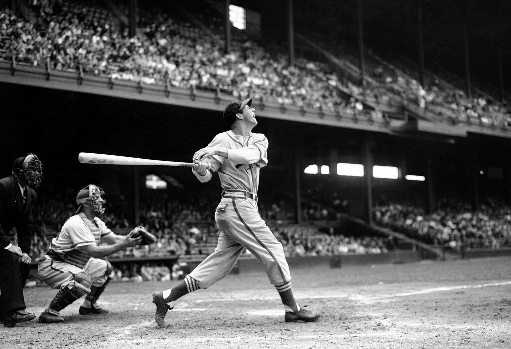 In this file photo, St. Louis Cardinals' Stan Musial bats against the Philadelphia Phillies...