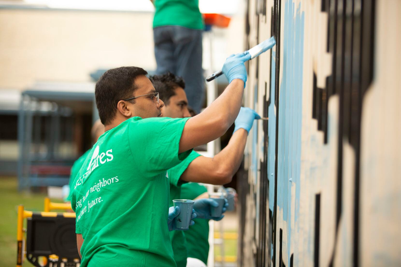 Fidelity Investments' workers have a history of volunteering at Thomas Jefferson High School.