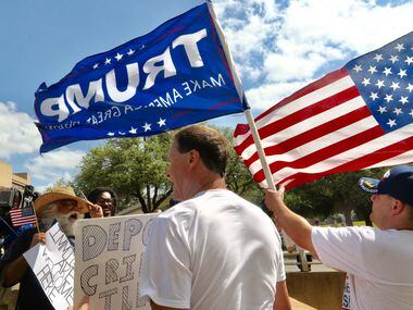 Casa Gaytan, left, debates with Trump supporters Rocky C Beaudreau, during the Dallas Mega...
