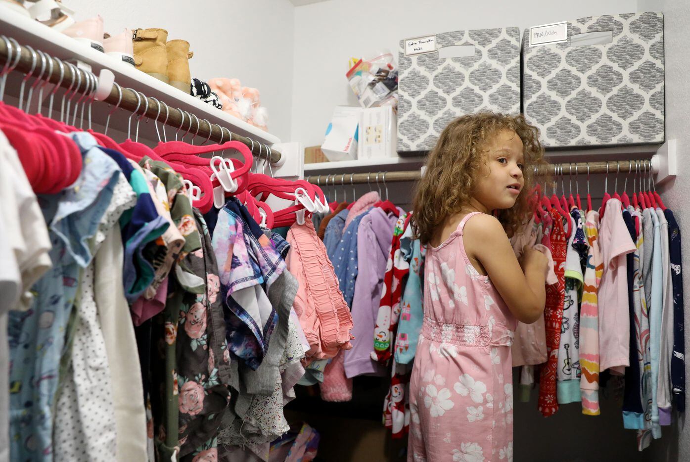 Lincoln Brooks, 4, picks out her pajamas for the night at the Brooks’ home in Sherman on...