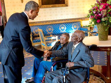 President Barack Obama greets Richard Overton, with Earlene Love-Karo, in the Blue Room of...
