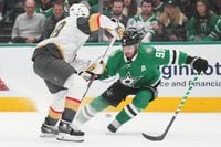 Dallas Stars center Tyler Seguin (91) fights for the puck against Vegas Golden Knights...