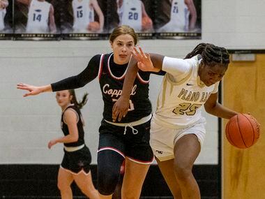 Coppell High School Julianna Lamendola (20) puts her hand through the arm of Plano East High...