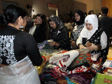 Attendees shop for fabric at  the  International Mother Language Day on Feb. 24 at DFW...