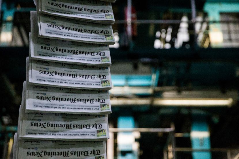Copies of The Dallas Morning News as printing presses roll at the newspaper's North Plant in...
