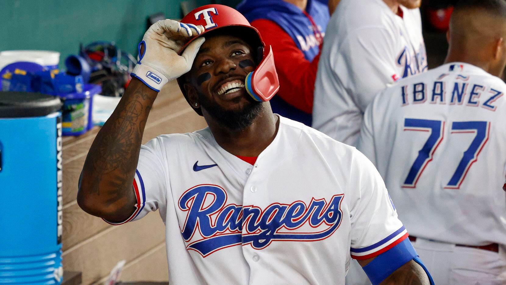 Texas Rangers center fielder Adolis Garcia (53) smiles after recording an RBI during the...