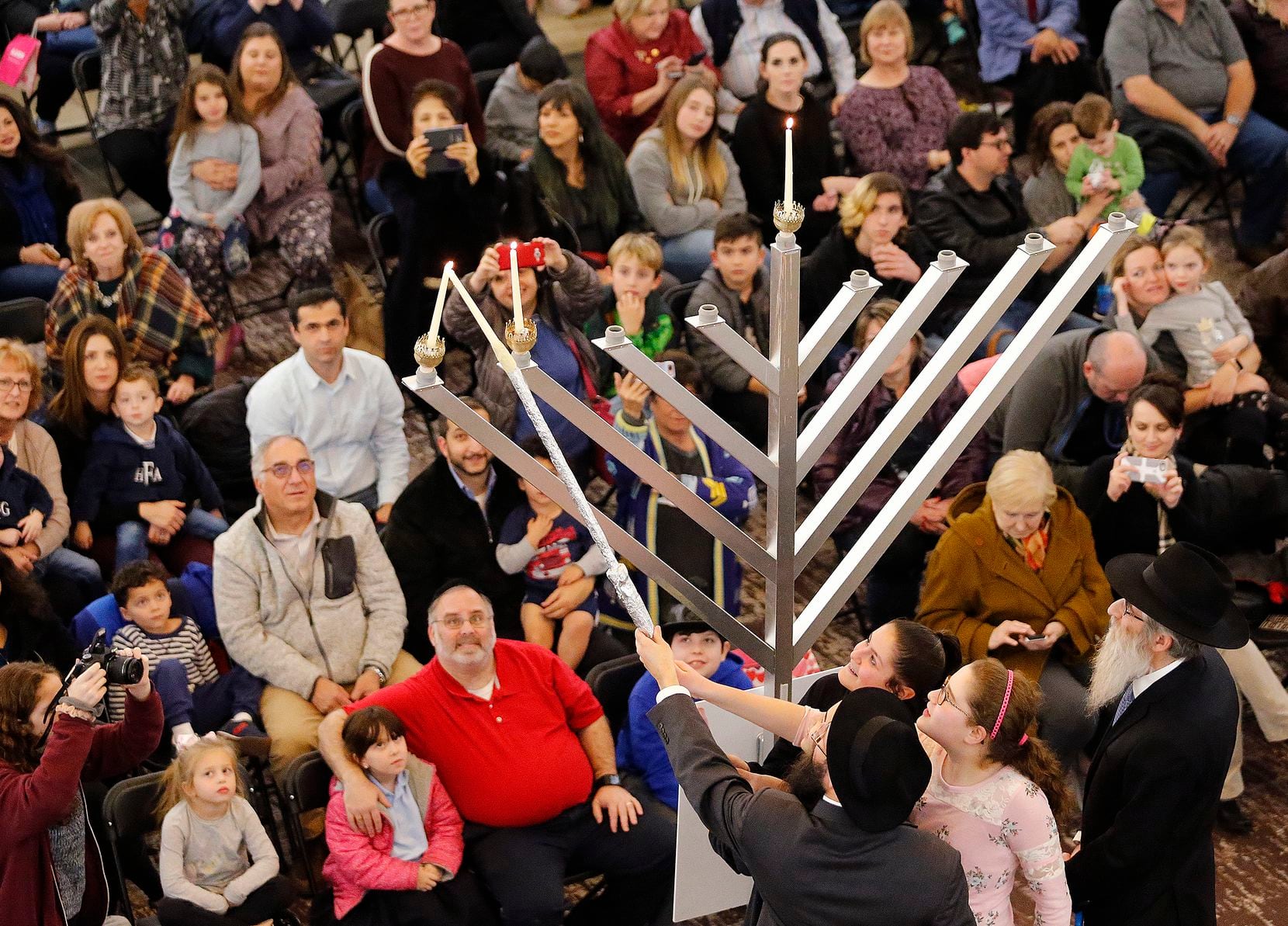 Families attended a menorah lighting at the Shops at Willow Bend in Plano in 2018. This year's event will be Nov. 29 in the shopping center's Restaurant District.