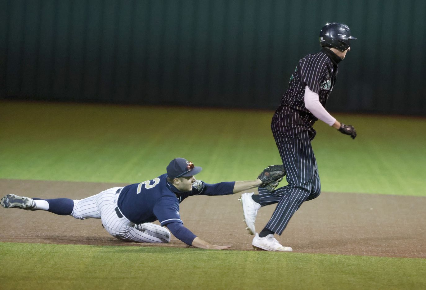 Keller’s Todd Baffa #2  tags out Southlake’s #20 Tyler White in a rundown to end the 4th inning during a Class District 4-6A baseball game in Souhtlake, Texas on March 19, 2021. (Michael Ainsworth/Special Contributor)