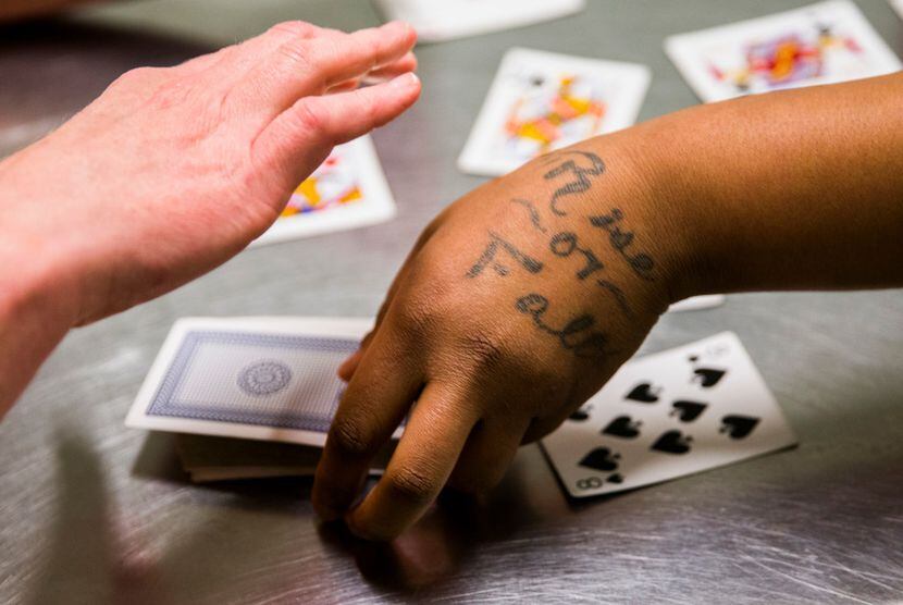 "Rise or Fall" is tattooed on the hand of inmate Sheniqua Miller as she and Stacy Jensen...