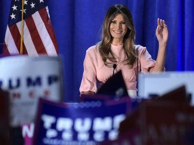 Melania Trump, the wife of Republican presidential nominee Donald Trump, waves as she makes...