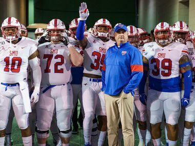 SMU head coach Sonny Dykes stands with his team before Mustangs take the field for an NCAA football game against Memphis at Liberty Bowl Memorial Stadium on Saturday, Nov. 2, 2019, in Memphis, Tenn.