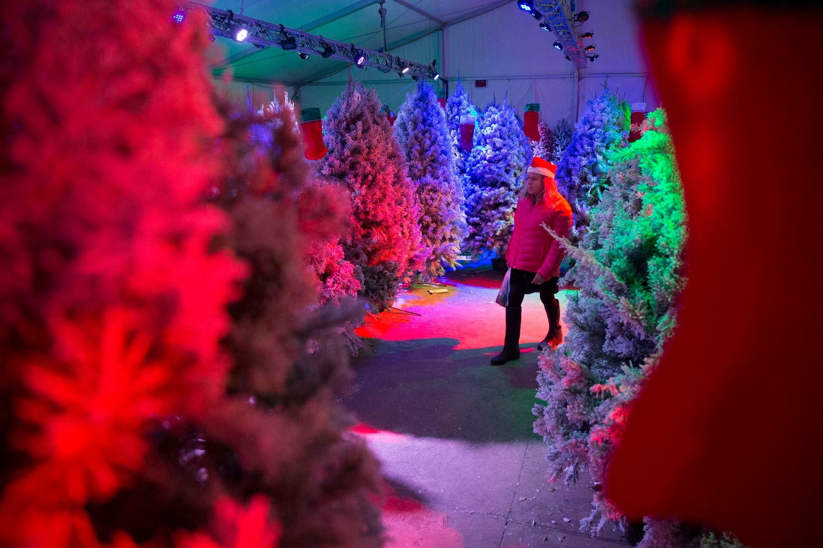 Maritza Capous of San Francisco, California explores the Christmas tree maze at Merry Main Street in Frisco, Texas on Saturday, Dec. 1, 2018. Capous was in town visiting her daughter.