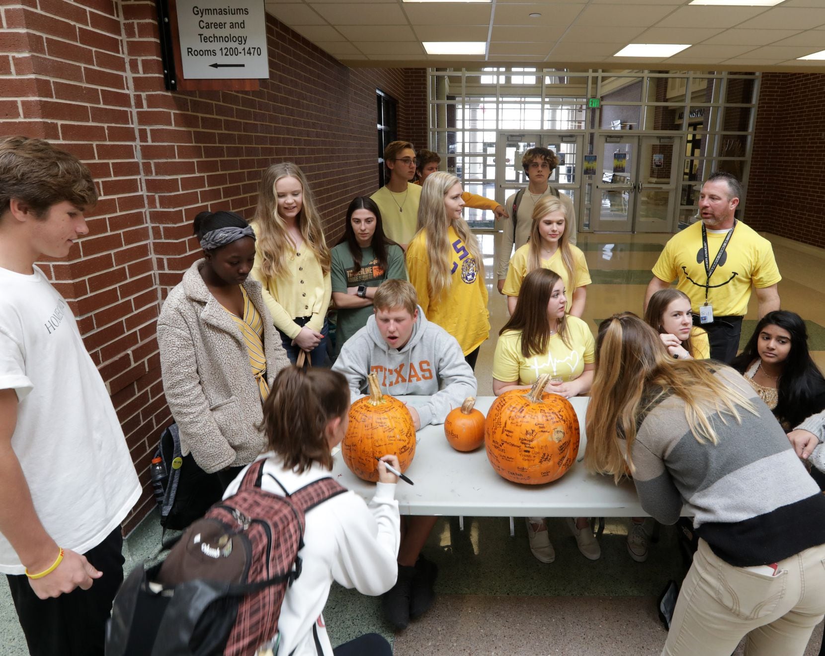 In addition to seeking out at-risk students, Hope Squad members, who often wear yellow — the...