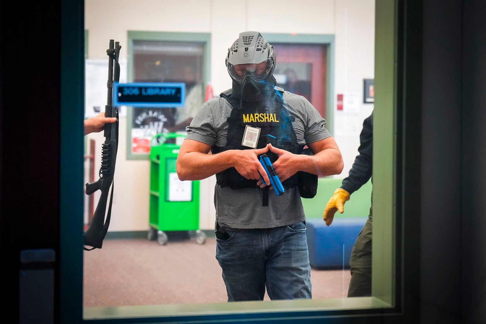 A Texas school marshal participates in an active-shooter training demonstration conducted at...
