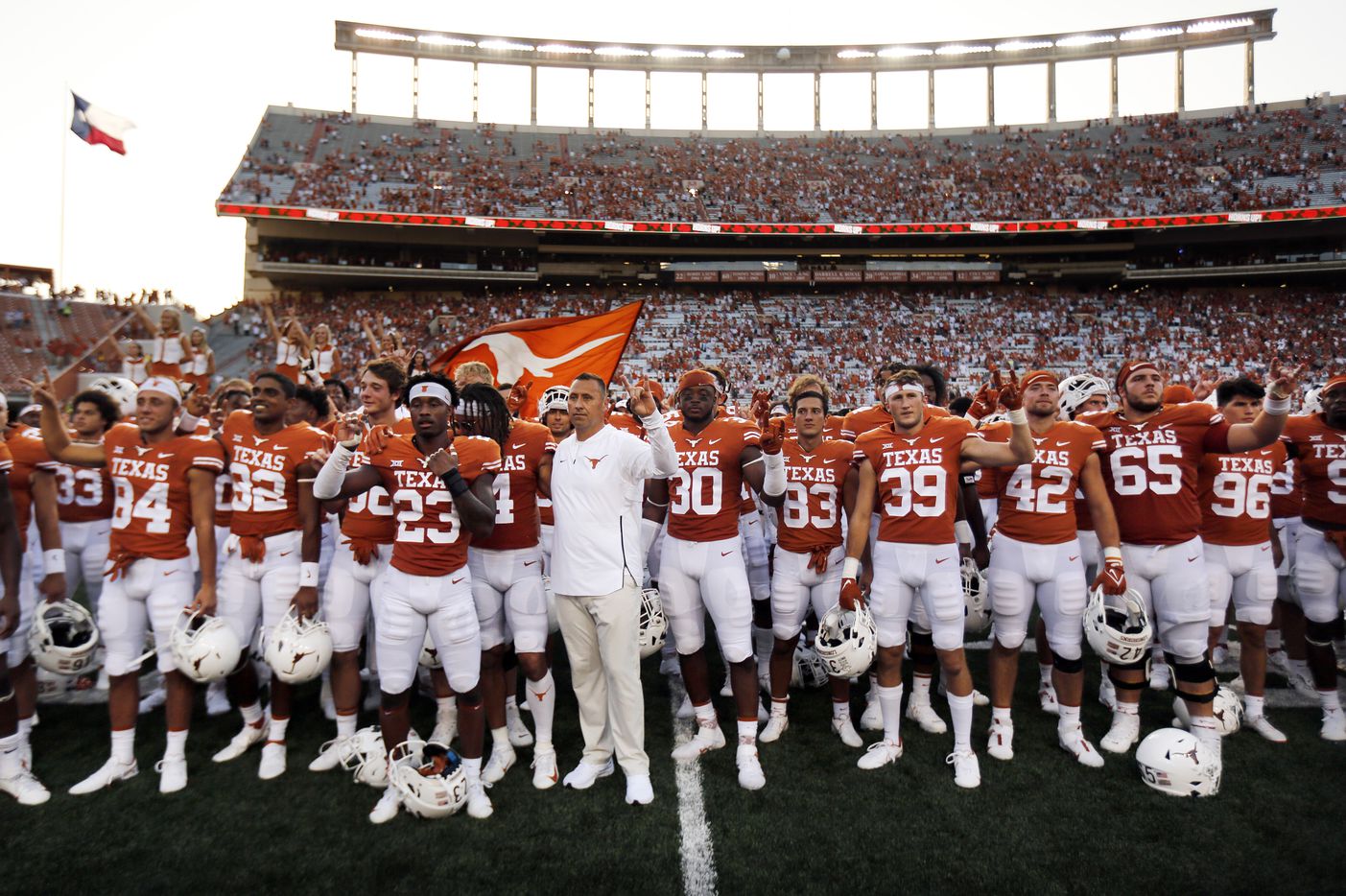 Texas Longhorns head coach Steve Sarkisian (center) and his players sing 'The Eyes of Texas' following their win over the Louisiana-Lafayette Ragin Cajuns at DKR-Texas Memorial Stadium in Austin, Saturday, September 4, 2021. (Tom Fox/The Dallas Morning News)