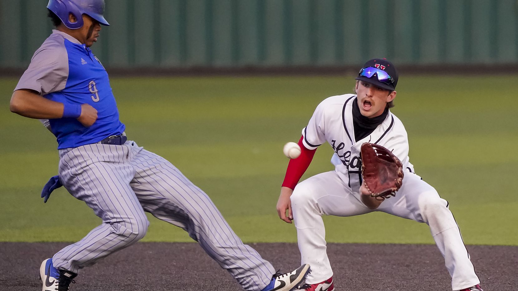 North Mesquite's Kai Howard gets back to second base ahead of the tag from Rockwall-Heath shortstop Karson Krowka during Rockwall-Heath's 12-1 victory Thursday.