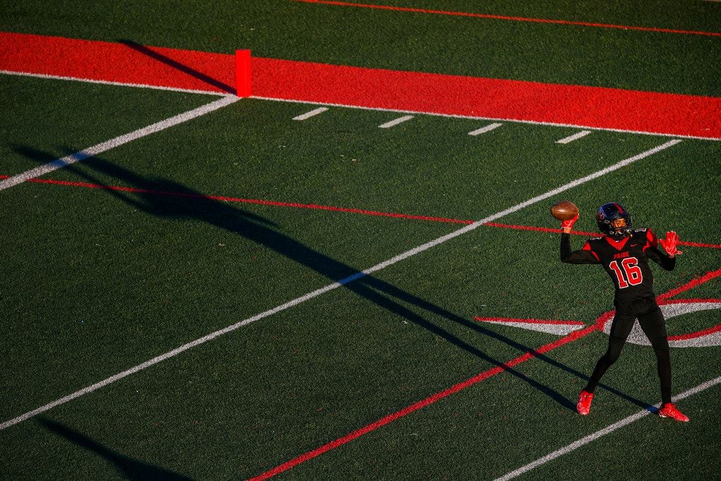 Colleyville Heritage cornerback Dylan McKinney warms up prior to a high school football game...