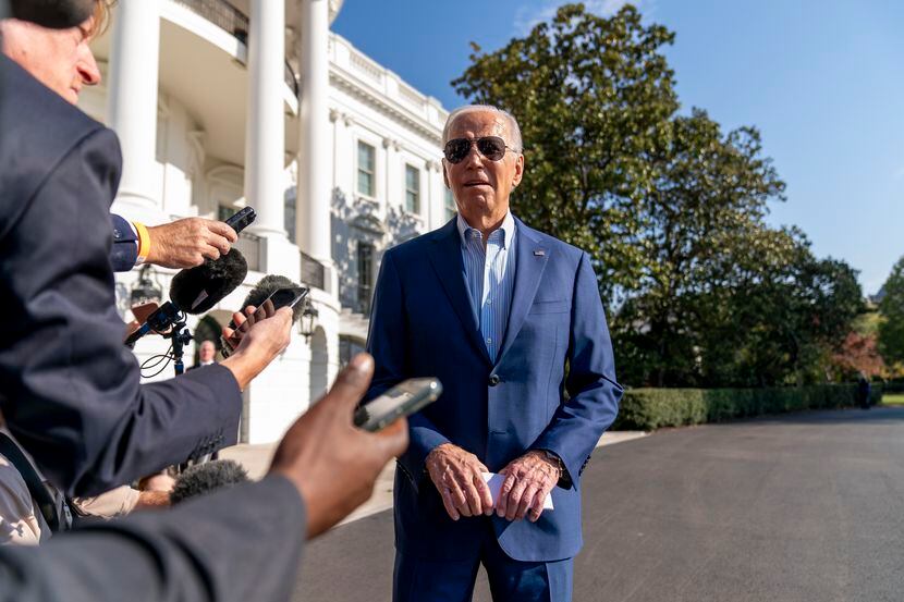 President Joe Biden takes questions from reporters before he boards Marine One on the South...