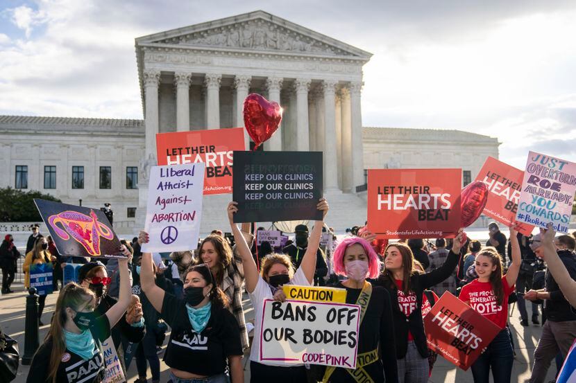 Pro-choice and anti-abortion demonstrators rally outside the U.S. Supreme Court on Nov. 1,...