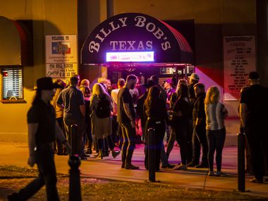 Patrons, largely without masks, line up to enter Billy Bob’s Texas in Fort Worth, Friday, March 12, 2021. Aaron Lewis performed Friday night, the first weekend concert at Billy Bob's since the mask mandate was lifted.