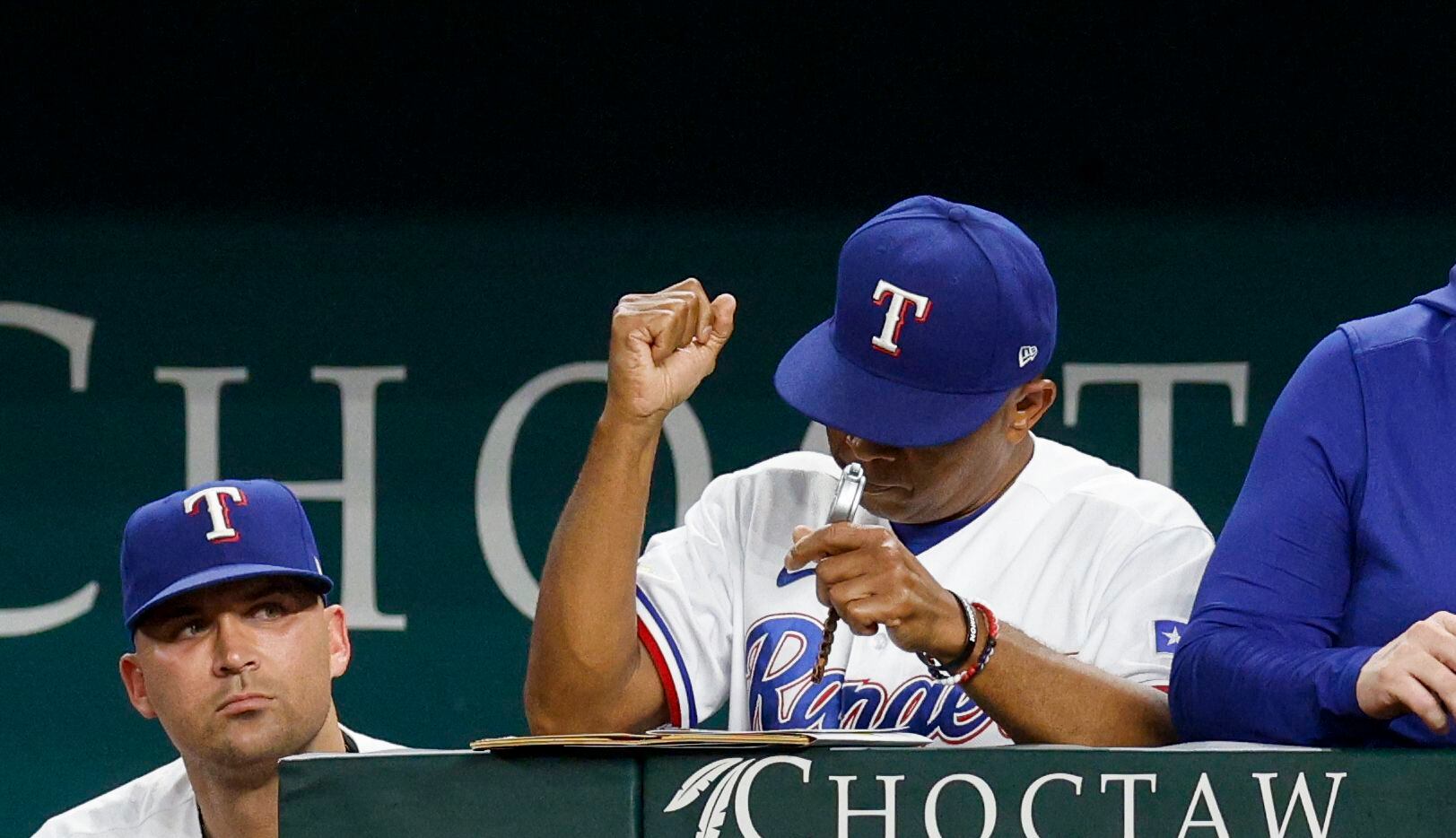 Texas Rangers interim manager Tony Beasley (27) pumps his fist after a game against the...