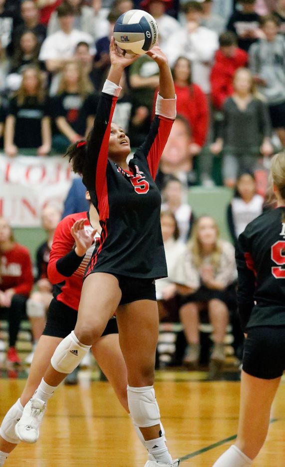 Lovejoy High School outside hitter Cecily Bramschreiber (5) sets the ball over the net in...