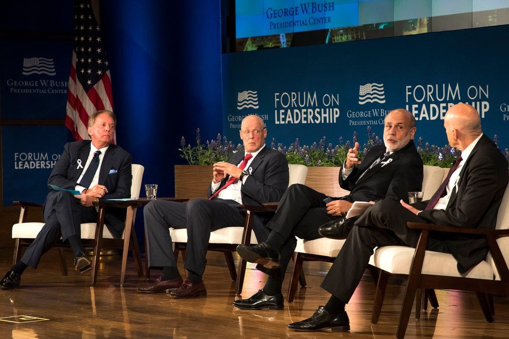 From left, moderator Terry Duffy, chairman and CEO of CME Group; Henry M. Paulson Jr.,...