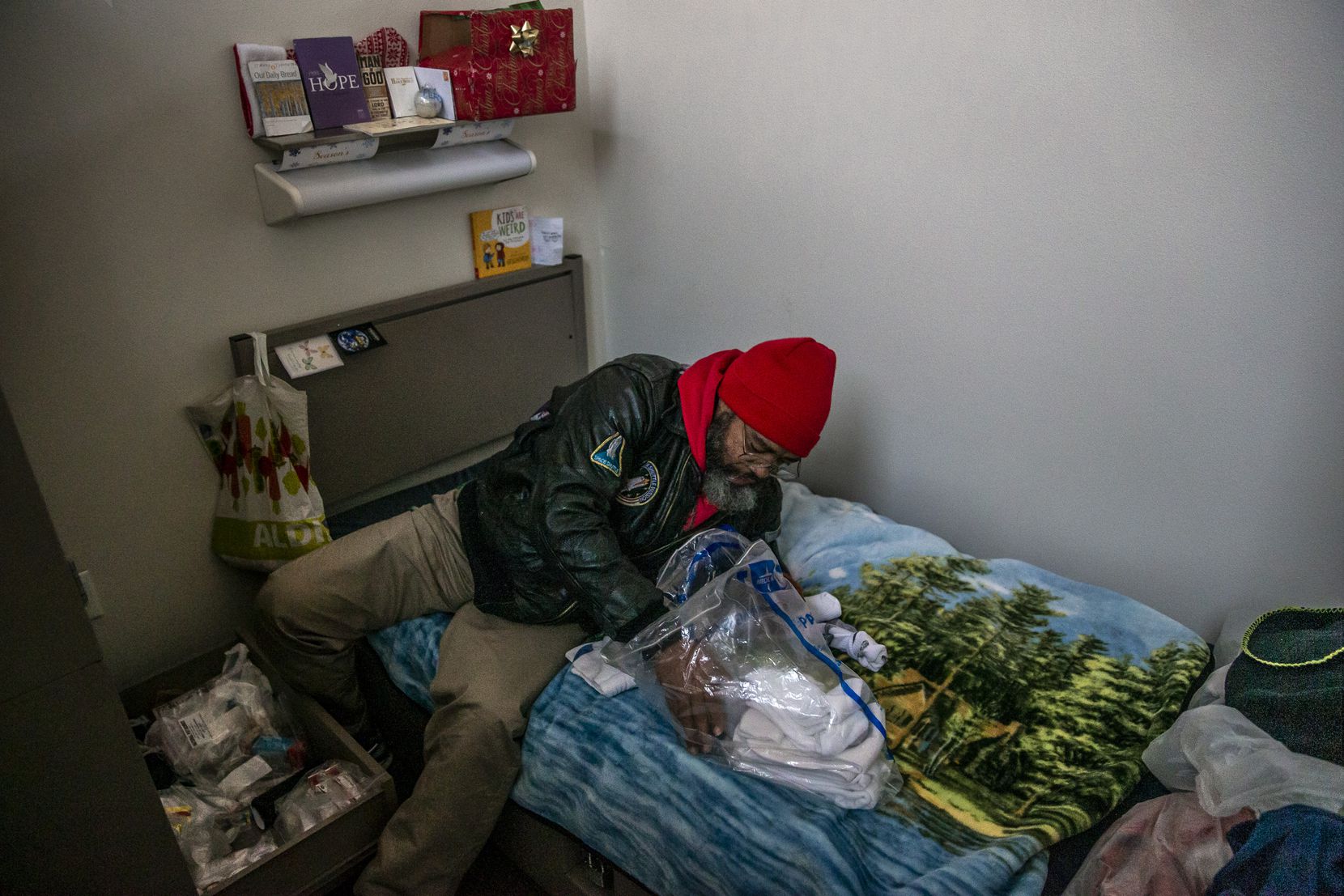 Randy organized a bag of socks on his bed to give to a friend who was also living at The Bridge Homeless Recovery Center in January 2020. “You really have to do as bests as you can by each other,” he said.