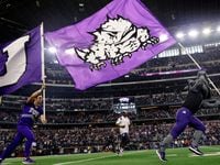 The TCU Horned Frogs mascot carries the school flag as the team is introduced before the Big...
