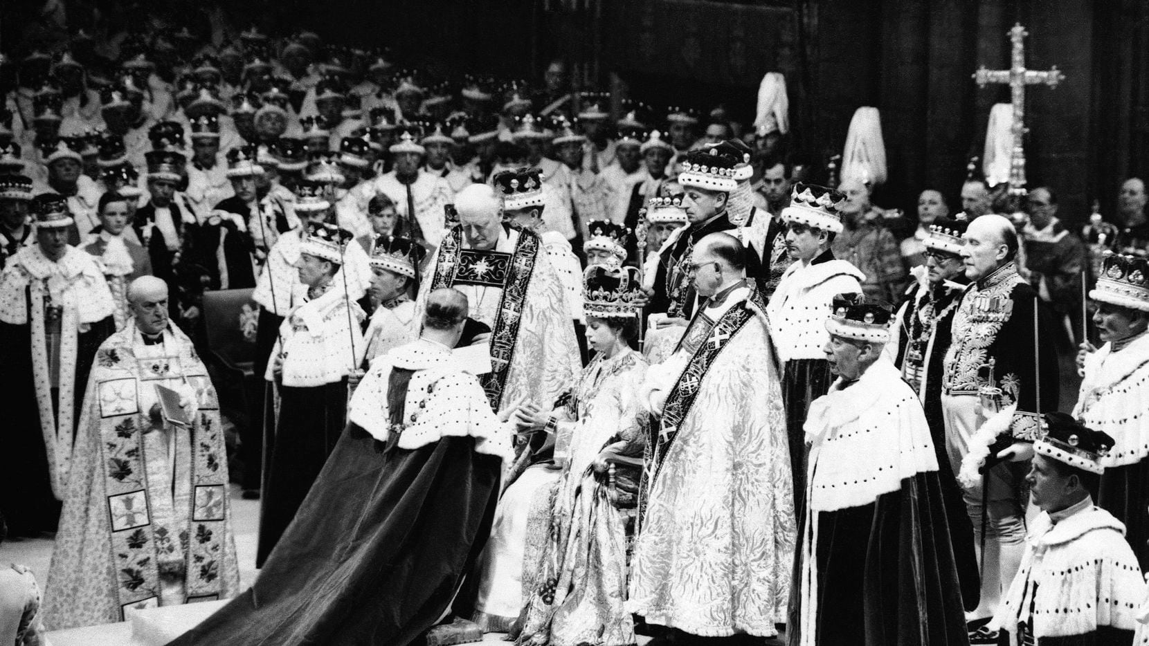 Queen Elizabeth II sits in the Chair of Estate in Westminster Abbey, London on June 2, 1953,...