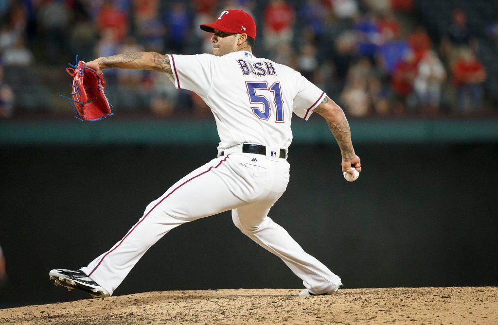 Texas Rangers relief pitcher Matt Bush pitches during the ninth inning against the Tampa Bay...