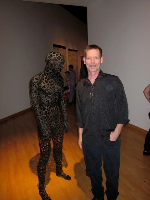 Bruce Monroe poses with his thesis sculpture at his 2011 graduation art show at the...