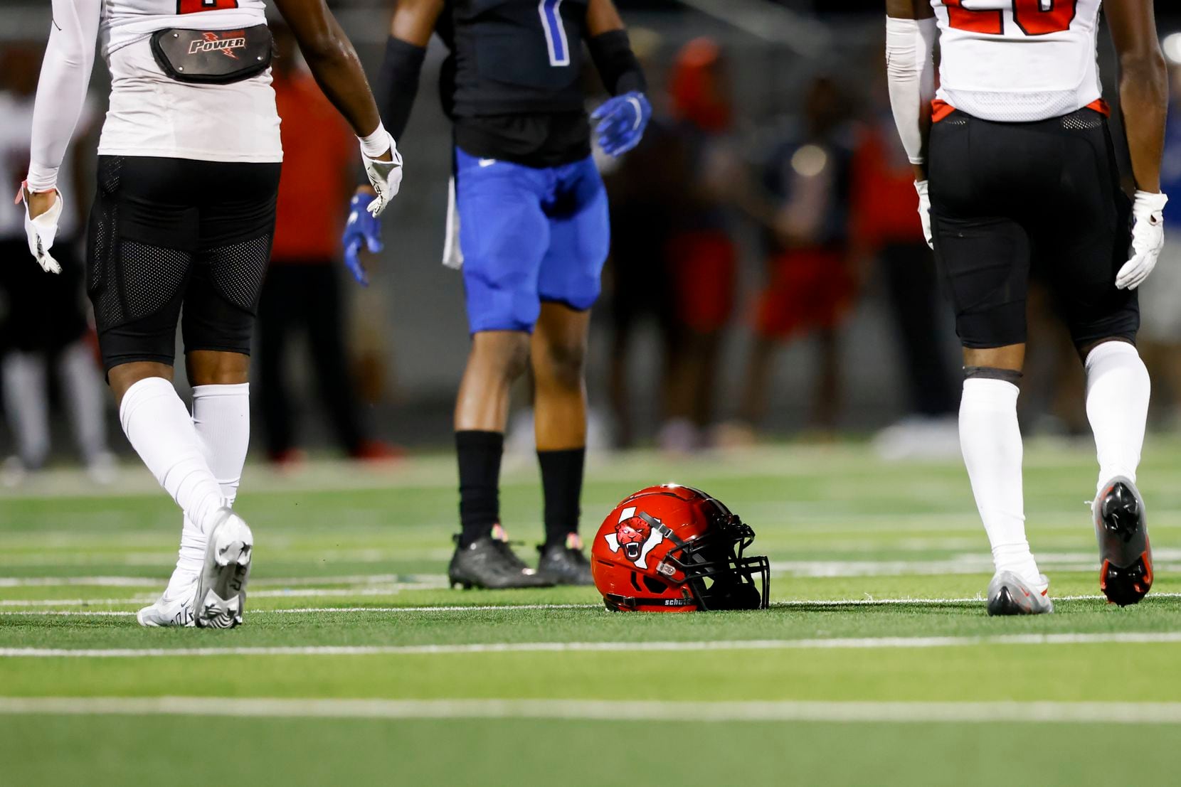 A Mesquite Horn helmet sits on the fields after a player is tacked by North Forney during...