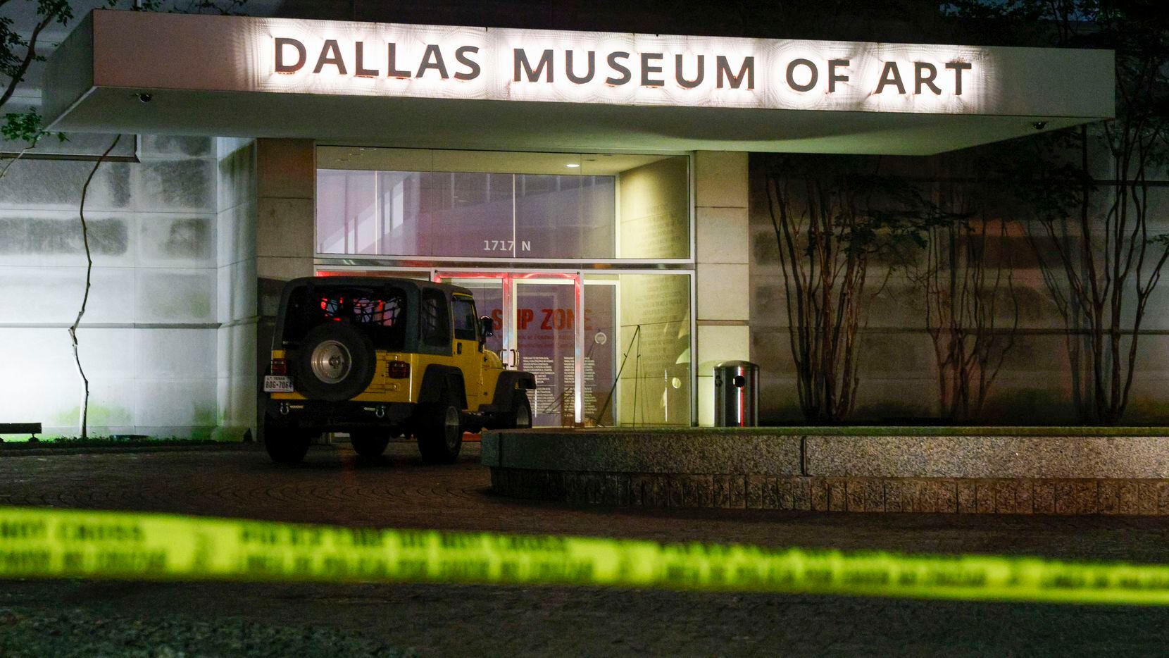 Police tape blocks an entrance to the Dallas Museum of Art entrance at Flora and Harwood...