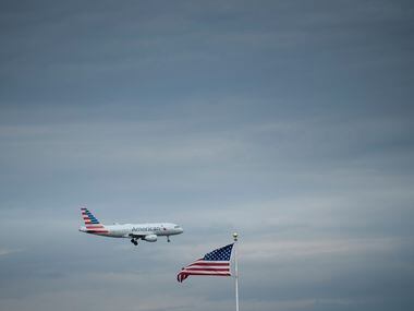 In this photo taken on May 9, 2019 an American Airlines passenger jet approaches Ronald Reagan Washington National Airport, in Arlington, Virginia.