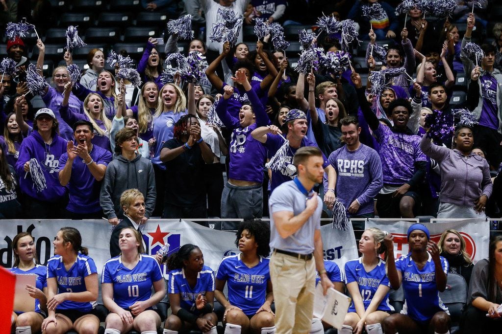 The Fort Bend Ridge Point student section celebrates during the fourth set during a class 6A...