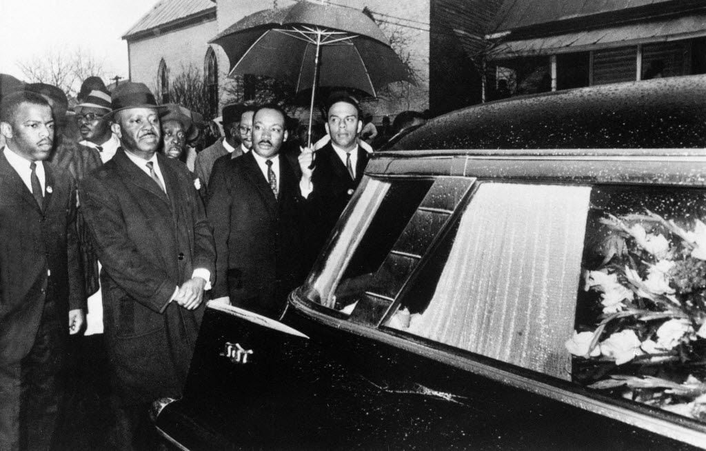 In this March 1, 1965, photo, the Rev. Martin Luther King Jr. and associates lead a...