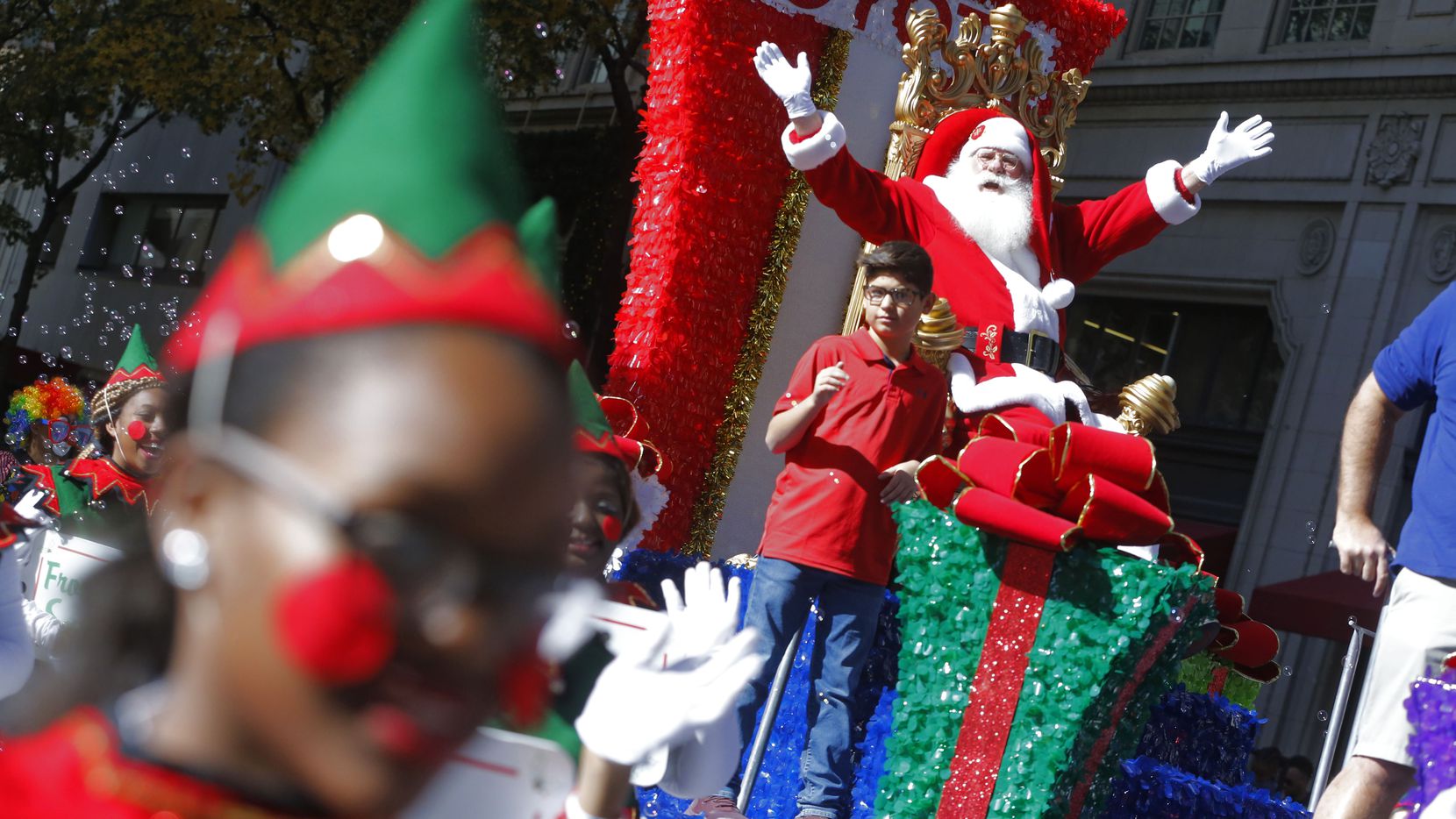 Santa Claus greets the people during the Dallas Holiday Parade on Dec. 1, 2018. (Nathan Hunsinger/The Dallas Morning News)