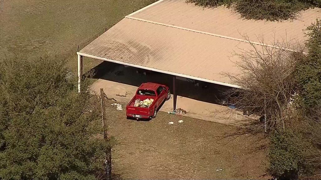 An aerial photo shows the home where officials say Wise County sheriff's deputies found four malnourished children under the age of 6, two of them locked in a kennel, earlier this month.