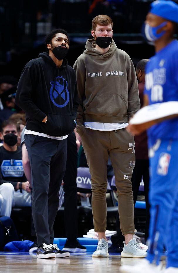 Dallas Mavericks forward Davis Bertans, left, and guard Spencer Dinwiddie are seen during the first half of an NBA basketball game against the LA Clippers in Dallas, Saturday, February 12, 2022. 