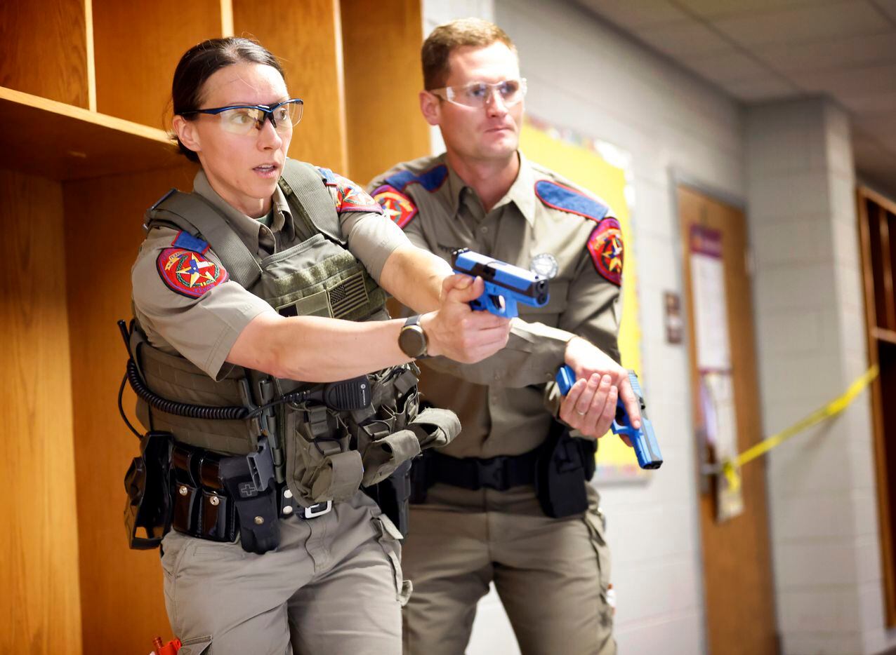Texas State Troopers Melissa Goodreau and Chuck Pryor approach a classroom during an...