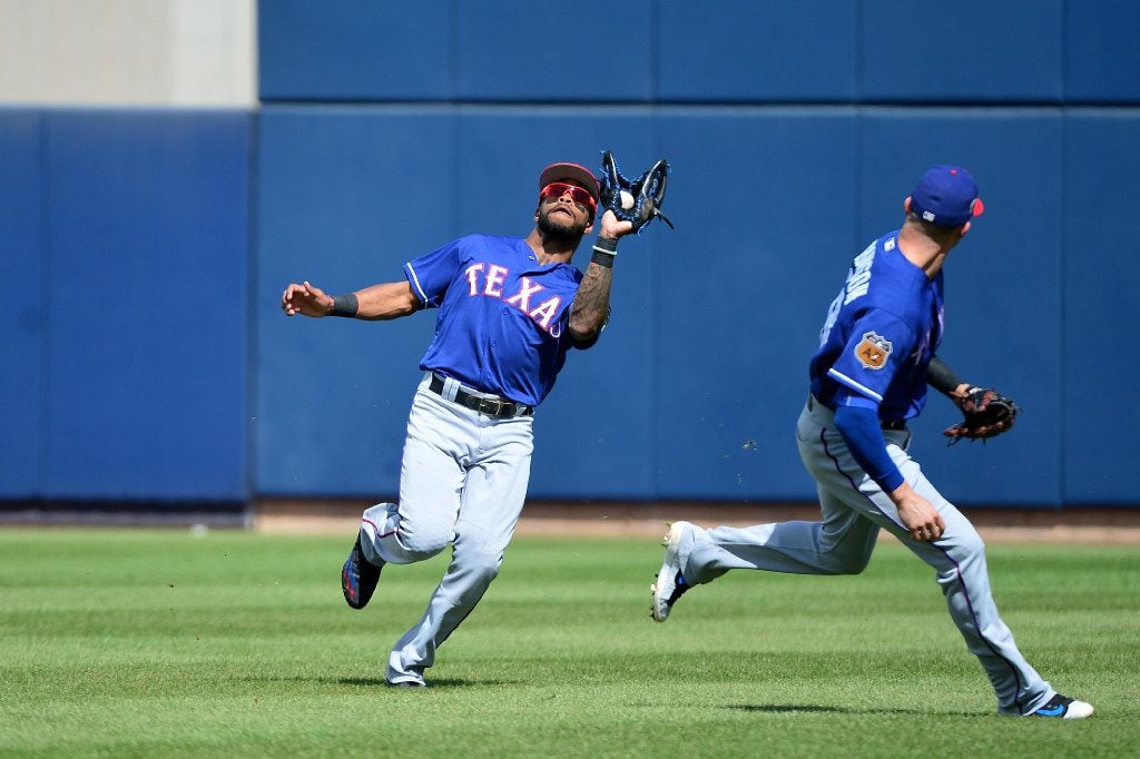 PHOENIX, AZ - MARCH 04:  Delino DeShields #3 of the Texas Rangers catches a fly ball in the second inning of the spring training game against the Milwaukee Brewers at Maryvale Baseball Park on March 4, 2017 in Phoenix, Arizona.  (Photo by Jennifer Stewart/Getty Images)