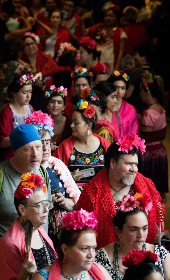 Dozens of Frida look-alikes stand in line at the Dallas Museum of Art during an attempt to...