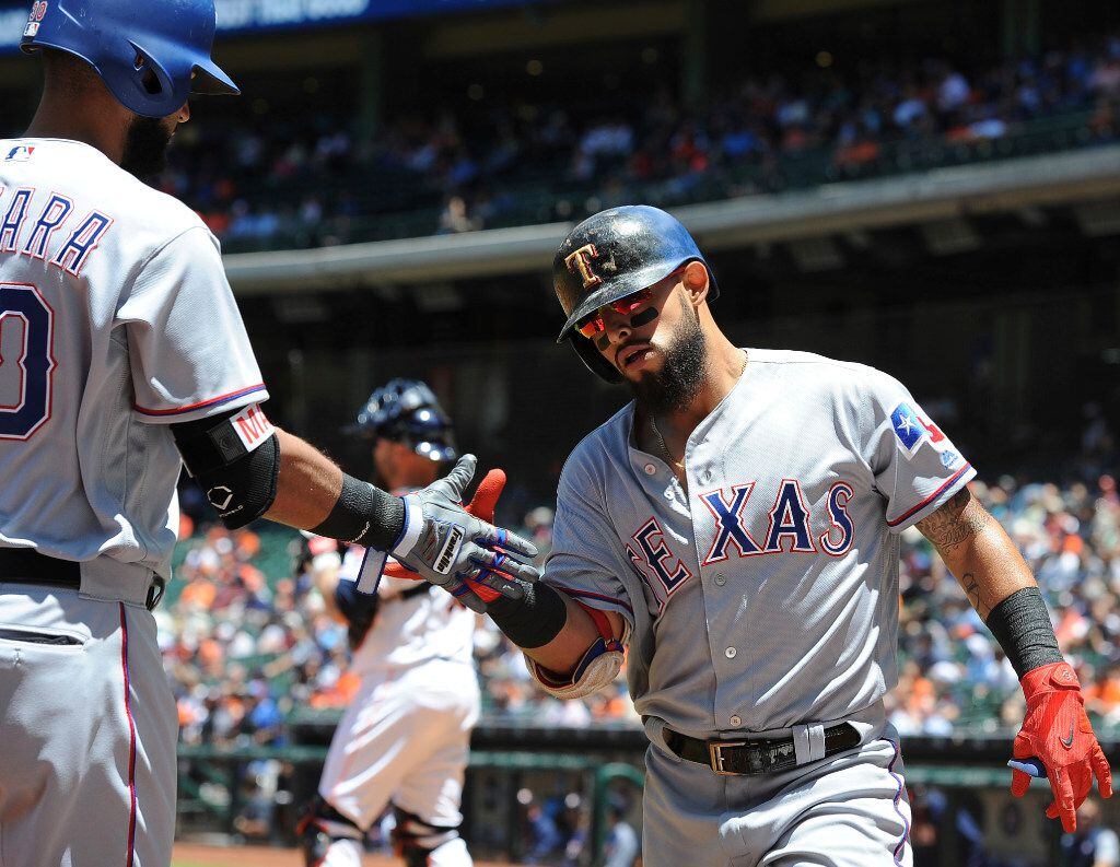 Texas Rangers' Rougned Odor, right, celebrates his solo home run against the Houston Astros...