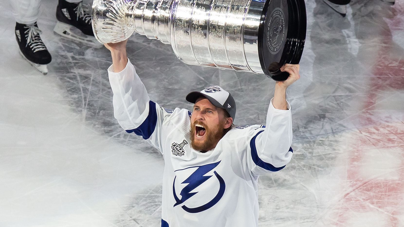 Blake Coleman (20) of the Tampa Bay Lightning hoists the Stanley Cup after defeating the Dallas Stars during Game Six of the Stanley Cup Final at Rogers Place in Edmonton, Alberta, Canada on Monday, September 28, 2020.